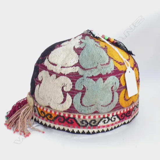 Uzbek skull cap with gold, aqua, black & white flower design.